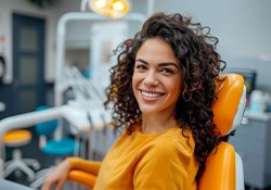 Smiling patient in dental treatment chair