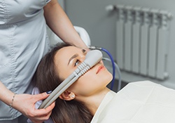 Female dental patient wearing nitrous oxide mask