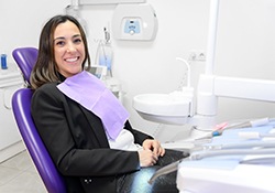 Happy, relaxed dental patient in treatment chair