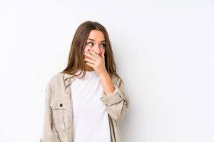 Concerned woman covering her mouth